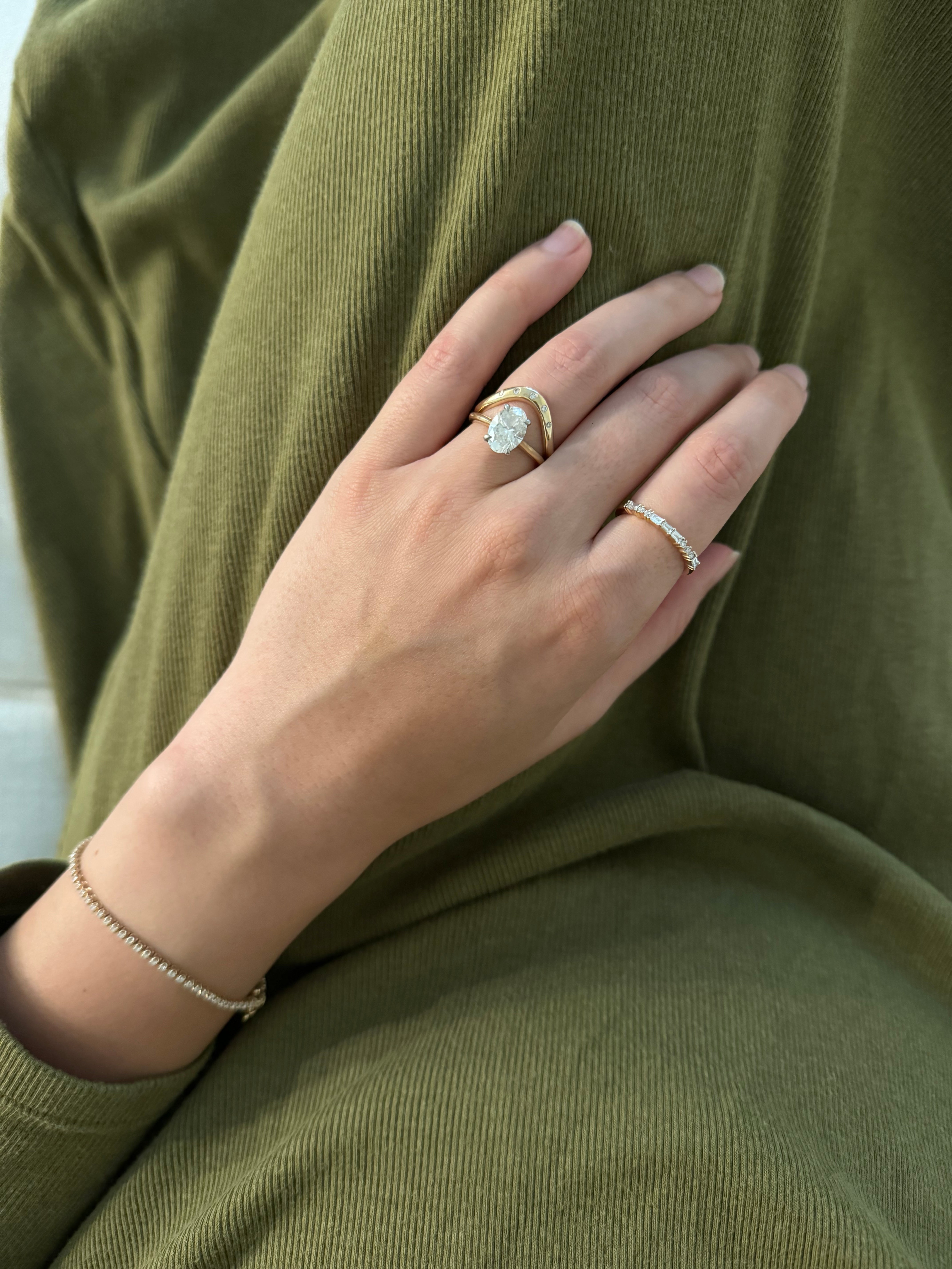 Gold Curvy Ring with Embedded Diamonds